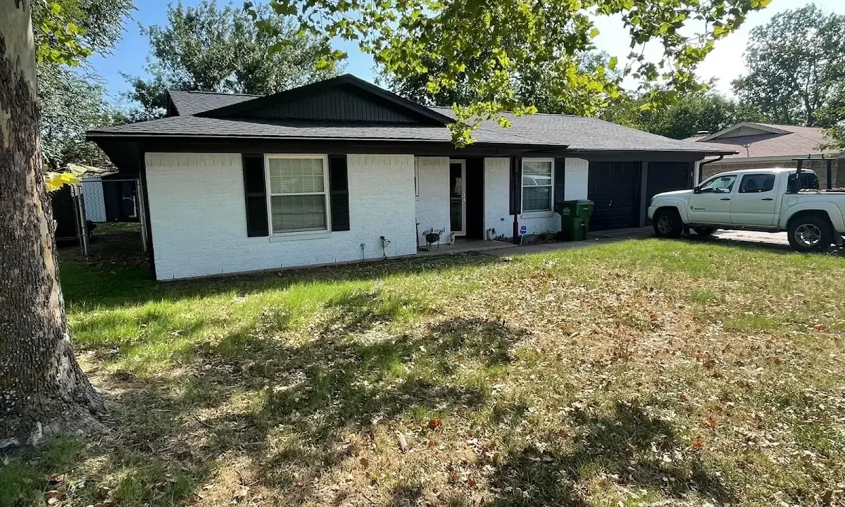 Professional roofing crew working on a residential roof in Parkway